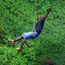 Zip-lining through Uganda's lush forests